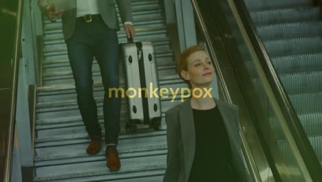 Animation-of-monkey-pox-over-caucasian-businesspeople-on-escalator