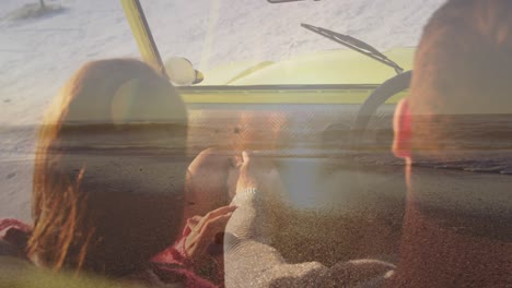 Animation-of-caucasian-couple-in-car-on-beach-over-seascape