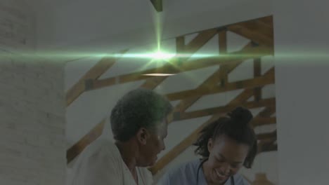 Animation-of-light-trails-over-diverse-doctor-and-patient