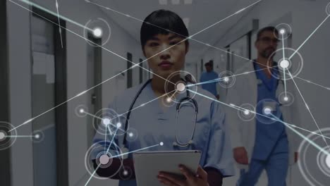 Animation-of-dots-connecting-with-lines-over-portrait-of-smiling-asian-female-doctor