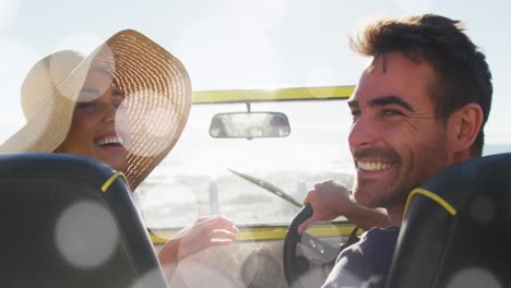 Animation-of-dots-over-happy-caucasian-couple-in-car-on-beach