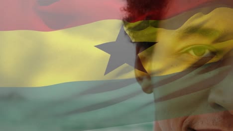 Animación-De-La-Bandera-De-Ghana-Sobre-Un-Hombre-Afroamericano-En-La-Playa.