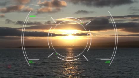 Animation-of-circular-interface-rotating-over-scenic-view-of-seascape-and-horizon-against-sky