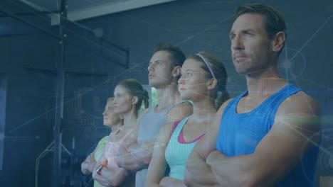 Animation-of-dots-connecting-with-lines-over-caucasian-people-with-arms-crossed-looking-away-in-gym