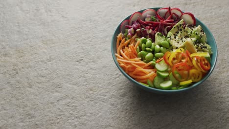 Composition-of-bowl-of-rice-and-vegetables-with-chopsticks-on-white-background