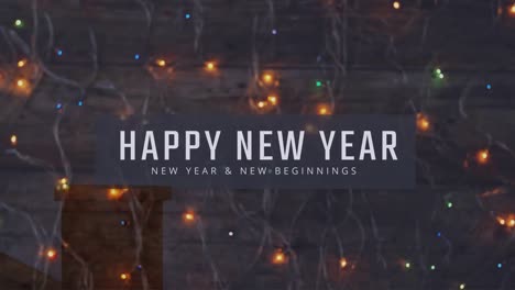 Animation-of-happy-new-year-text-over-fairy-lights