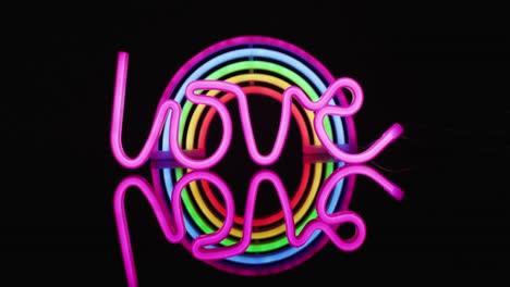 Animation-of-pink-neon-lights-forming-love-text-over-rainbow-on-black-background
