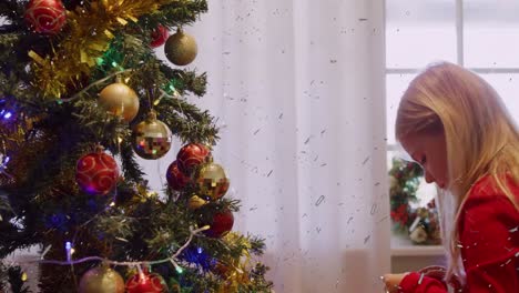 Animation-of-confetti-over-christmas-tree-and-caucasian-girl