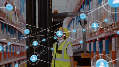 Animation-of-networks-of-connection-with-people-icons-over-caucasian-man-working-in-warehouse