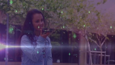 Animation-of-green-arrows-and-data-processing-over-smiling-biracial-woman-using-smartphone-outdoors