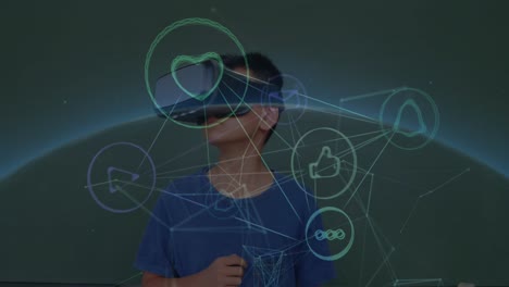 Animation-of-connected-icons,-codes,-globe-over-caucasian-boy-playing-while-using-vr-headset