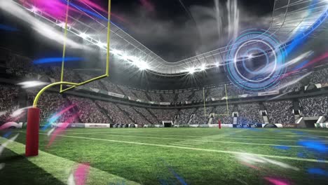 Animation-of-circular-scanner-and-coloured-lights-over-american-football-sports-stadium-pitch-pitch
