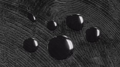 Animation-of-water-drops-on-changing-wood-grain-pattern,-black-and-white