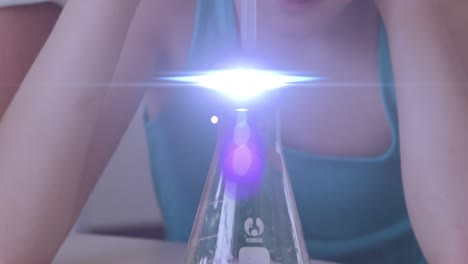 Animation-of-glowing-lights-over-caucasian-girl-with-pipette-and-chemistry-beaker