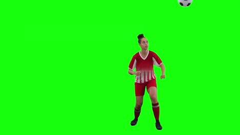Video-of-caucasian-female-football-player-head-kicking-football-and-copy-space-on-green-screen