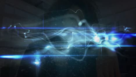 Animation-of-light-trails-over-biracial-woman-using-smartphone