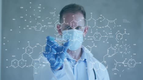 Animation-of-chemical-formula-over-caucasian-male-doctor-wearing-face-mask-holding-tube-with-vaccine