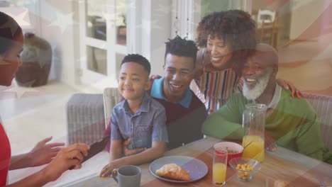 Animation-of-flag-of-usa-over-african-american-family-taking-selfies
