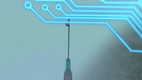 Animation-of-integrated-circuit-over-syringe-needle