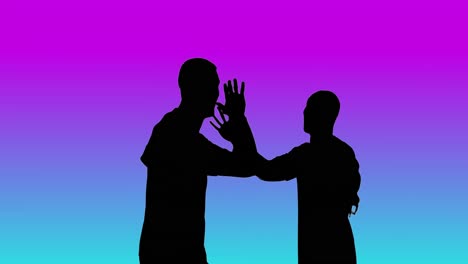 Video-of-black-silhouettes-of-two-male-soccer-players-cheering-on-blue-to-purple-background