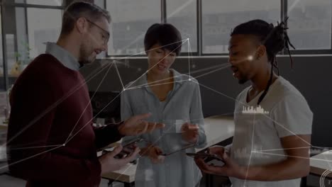 Animation-of-network-of-connections-over-diverse-office-colleagues-discussing-at-office