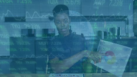 Animation-of-financial-data-processing-over-african-american-businesswoman