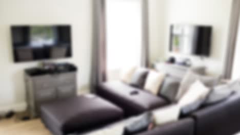 Animation-of-blurred-house-interior-with-couch-and-tv