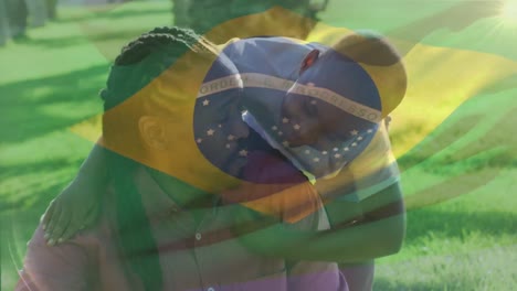 Animation-of-flag-of-brazil-over-african-american-father-with-son