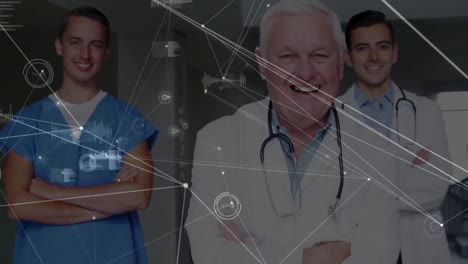 Animation-of-network-of-connections-over-team-of-medical-health-workers-smiling-at-hospital