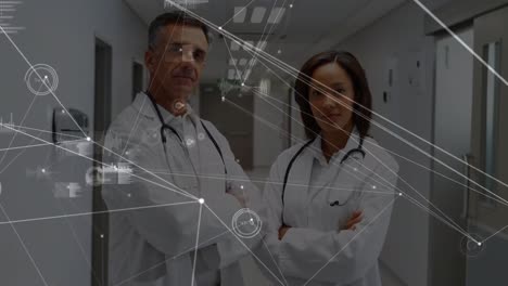 Animation-of-network-of-connections-over-diverse-male-and-female-doctor-smiling-at-hospital