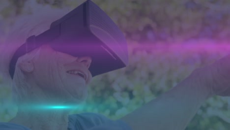Animation-of-light-spots-over-senior-caucasian-man-with-vr-headset