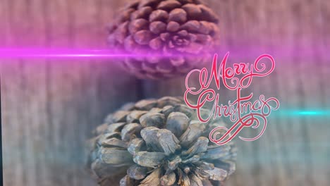 Animation-of-merry-christmas-text-and-light-trails-over-cones
