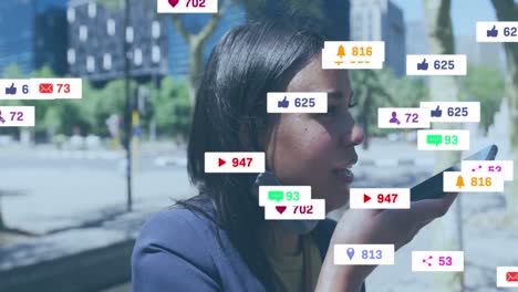 Animation-of-social-media-icons-with-numbers-over-african-american-woman-talking-on-smartphone