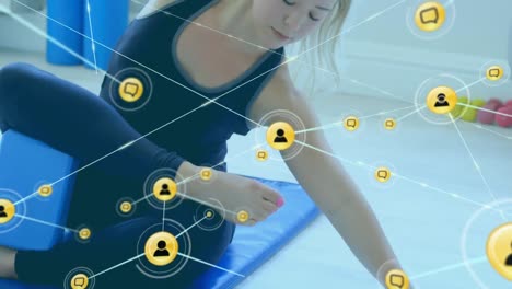Animation-of-network-of-connections-with-icons-over-caucasian-woman-stretching