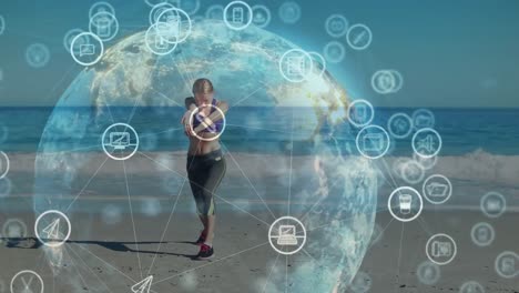 Animation-of-circles-with-computer-icon-around-globe-over-caucasian-woman-practicing-yoga-at-beach