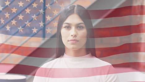 Animation-of-flag-of-usa-over-caucasian-businesswoman-in-office
