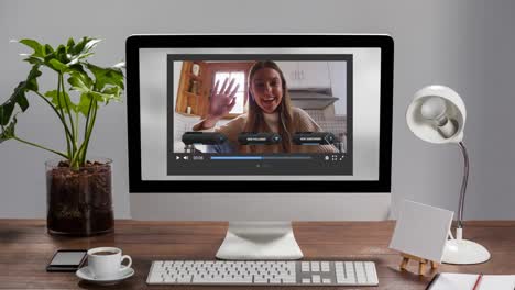 Animation-of-social-media-screen-on-computer-over-caucasian-woman-making-video-blog