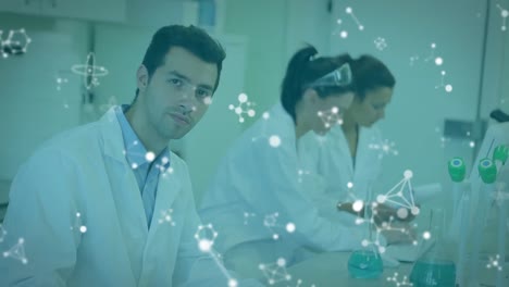 Animation-of-multiple-floating-molecules,-caucasian-male-researcher-smiling-and-writing-on-notepad