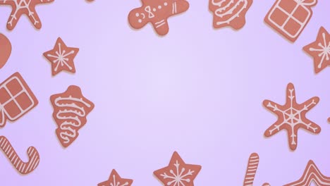 Animation-of-gingerbread-falling-at-christmas-over-blue-background