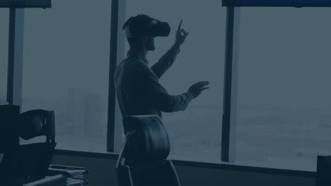 Animation-of-hexagon-shape-over-caucasian-businessman-wearing-vr-headset-gesturing-by-window