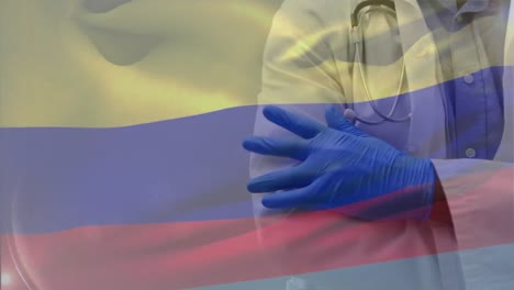 Animation-of-flag-of-colombia-over-african-american-female-doctor
