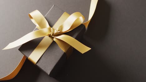 Video-of-christmas-gift-and-copy-space-on-black-background