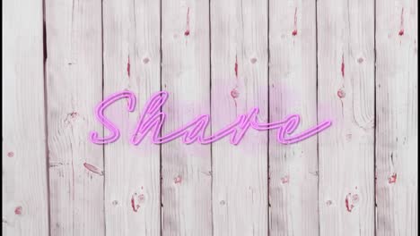 Animation-of-illuminated-pink-share-text-over-wooden-background