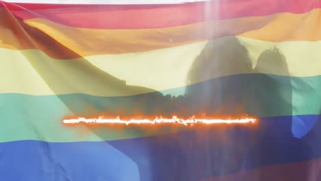 Animation-Von-Lichtspuren-über-Menschen,-Die-Die-LGBT-Flagge-Halten