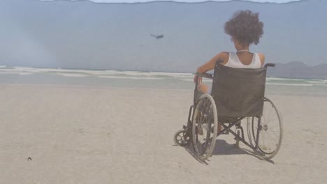 Animation-of-sea-landscape-over-disabled-african-american-woman-sitting-in-wheelchair