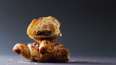 Video-of-close-up-of-croissants-on-gray-background