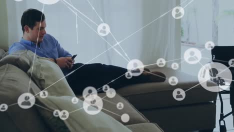 Animation-of-network-on-connections-over-disabled-cuacasian-man-lying-on-bed-using-smartphone