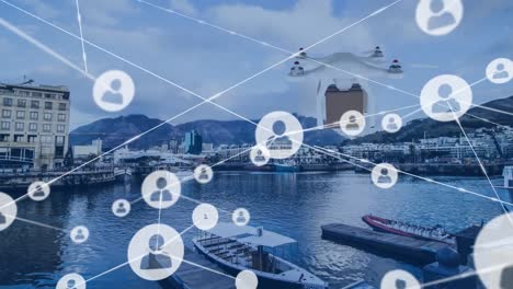 Animation-of-profile-icons-connected-with-lines-and-drone-flying-over-boats-moored-at-harbor-in-city