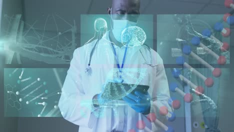 Animation-of-dna-strand-and-medical-data-over-african-american-male-doctor-in-face-mask-using-tablet