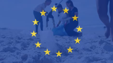 Animation-of-flag-of-eu-over-diverse-volunteers-cleaning-beach